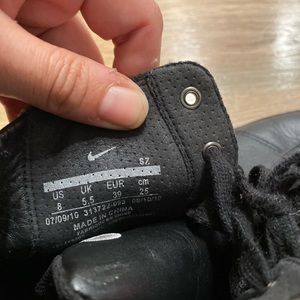 Unisex blk high tops  nike w silver studs.